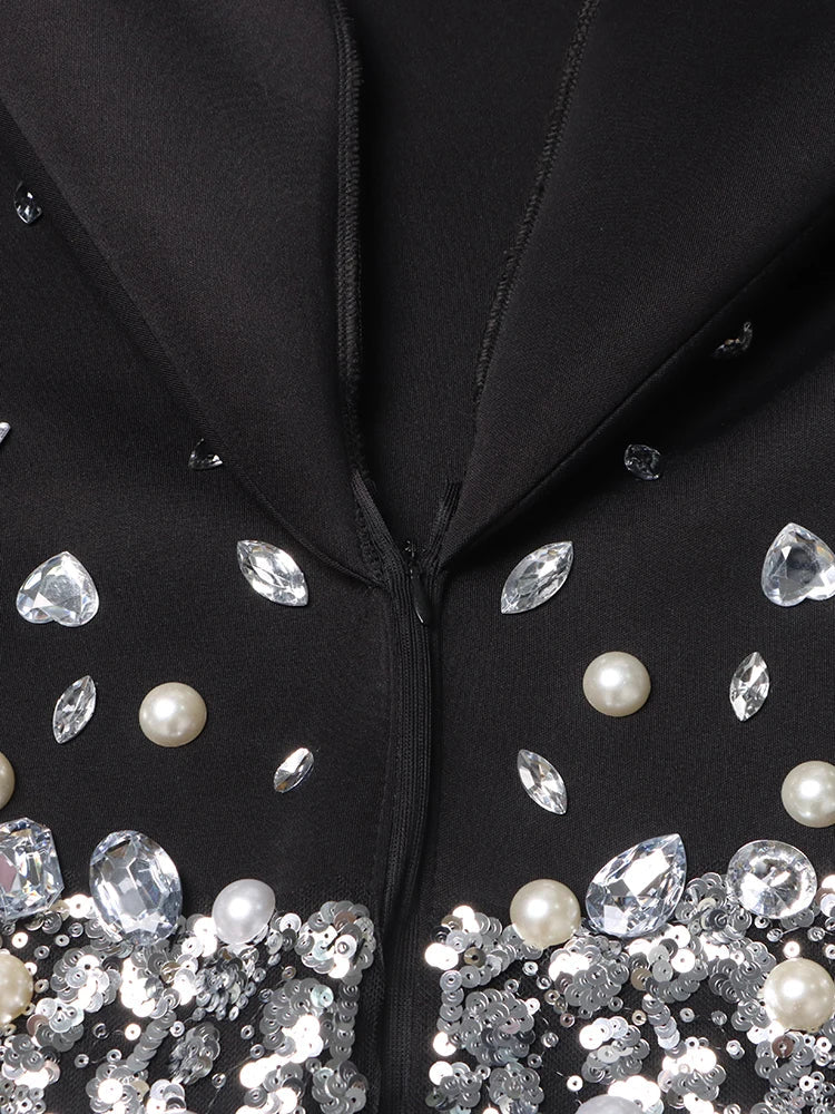 Beyoncé - Vestido blazer con diamantes empalmados