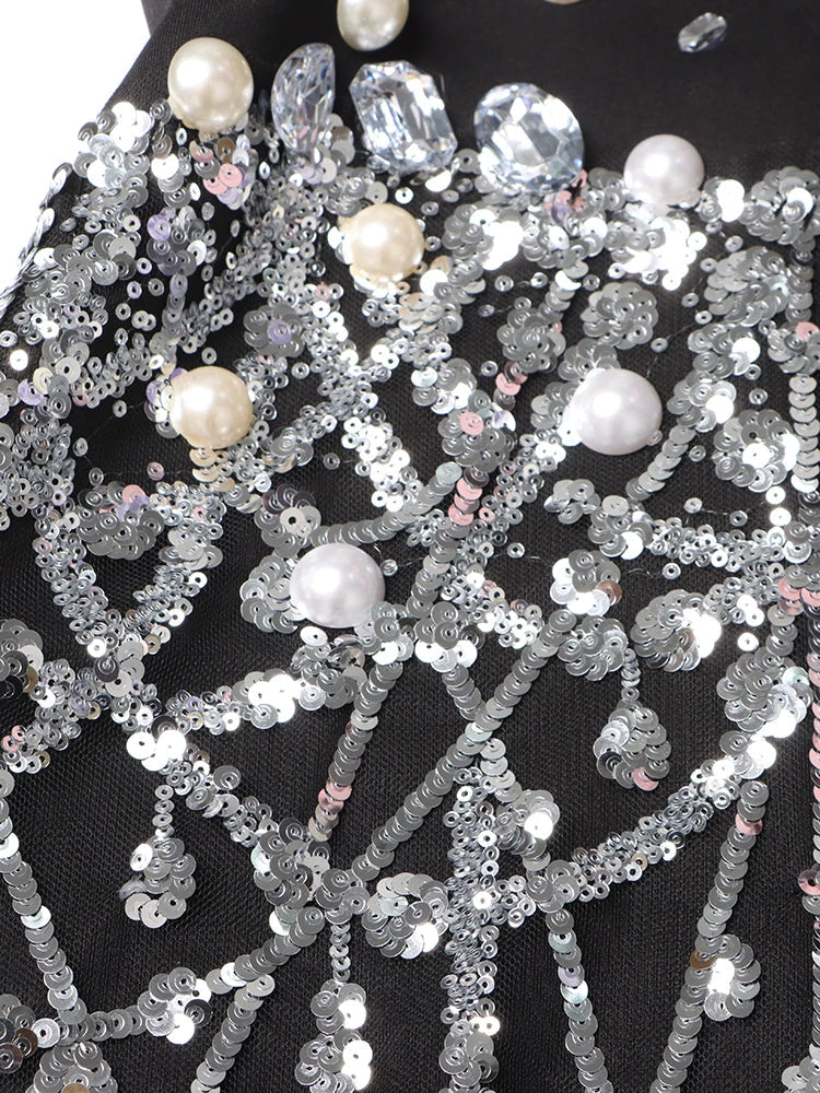 Beyoncé - Vestido blazer con diamantes empalmados